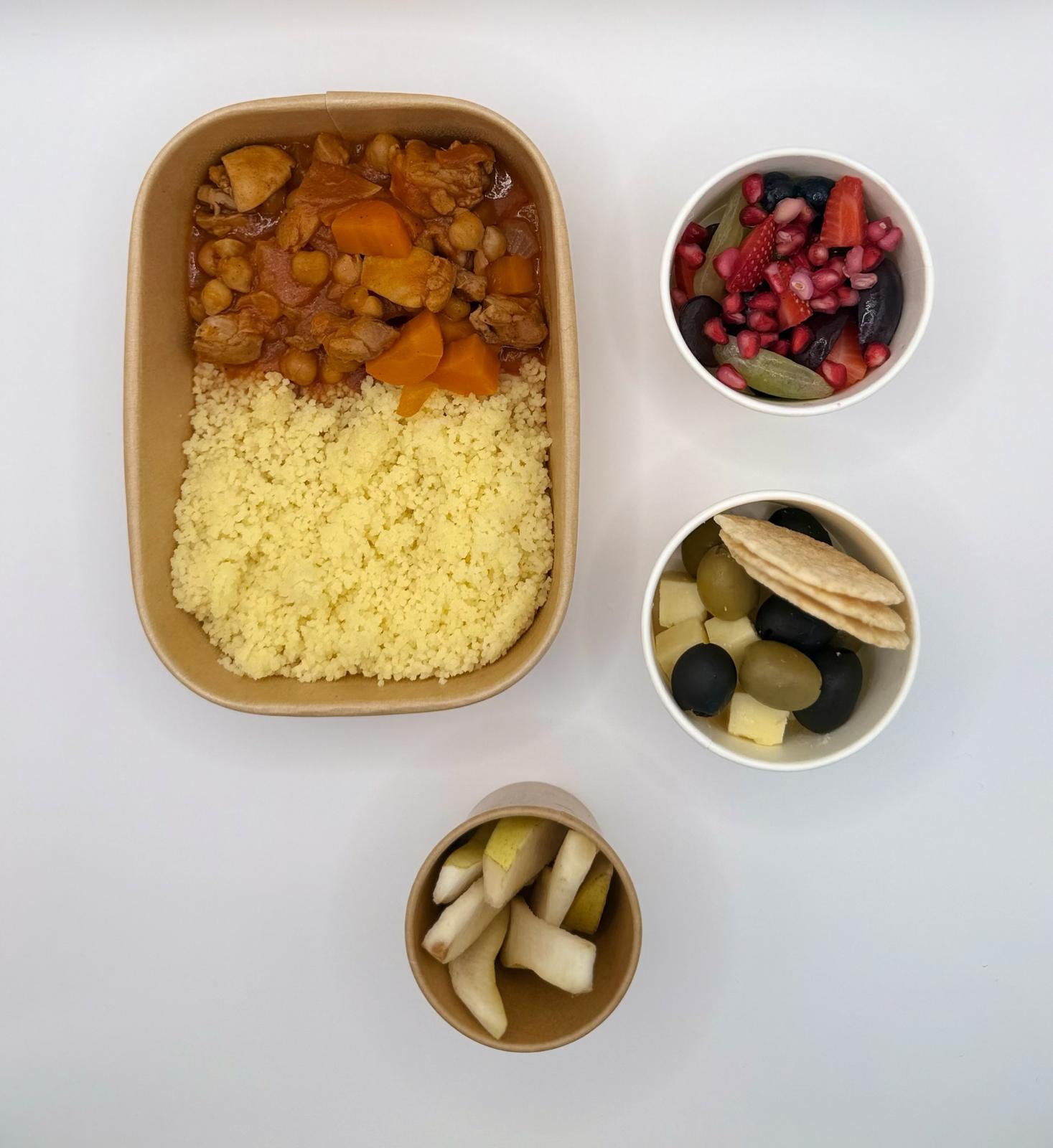 Chicken and chickpea couscous with a fruit pot, olives and cheese