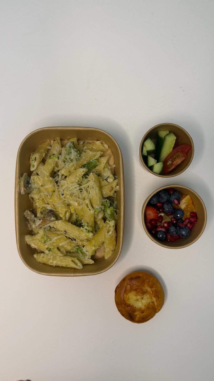 Creamy broccoli pasta with fresh veg, mixed berries and a cheese muffin